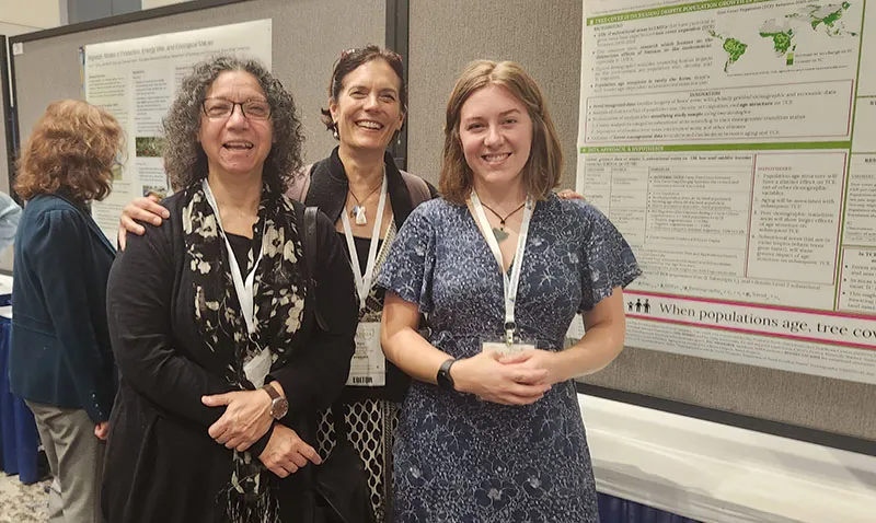 Photograph of CIESIN research Scientist Susana Adamo with co-authors Sara Curran and Courtney Allen in front of their poster at the 2024 Population Association of America meeting.